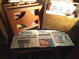 lot 197 image: 2 Magazine racks full of magazines and maps - Mad, mother earth news, Fur-fish game, Gopher Historian. Life, 911 newspapers and more