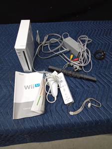 lot 53 image: Wii with controllers and cords and manual