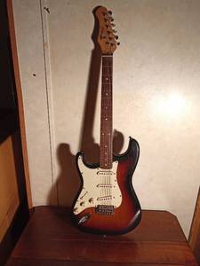 lot 10 image: Stagg SES-30 electric guitar in cloth case