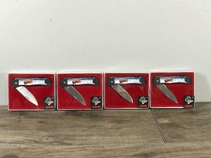 lot 381 image: Lot of 4 Hawk Knives in Original Packages - Bears Catching Salmon