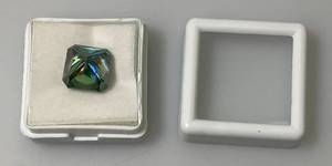 lot 119 image: 7.50 Ct. Lab Created VVS1 Vivid Blue Radiant Cut Massonite Gemstone (In Protective Case)