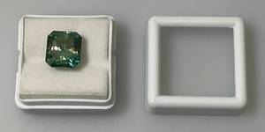 lot 120 image: 6.55 Ct. Lab Created VVS1 Vivid Blue Radiant Cut Massonite Gemstone (In Protective Case)