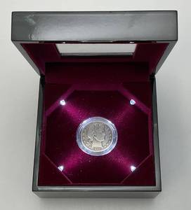 lot 10 image: 1899 Silver Barber Half Dollar In Lighted Case