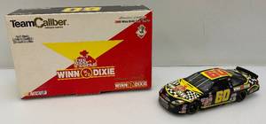lot 208 image: Vintage Team Caliber Owners Series 124 Scale Die Cast Replica Limited Edition 2000 Winn Dixie #60 Ford Taurus (New Old Stock) With COA
