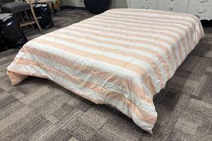 lot 414 image: Pillowfort Peach & White Striped Comforter - Queen Size