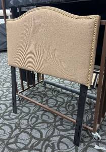 lot 811 image: Belnick Twin Headboard - Beige Upholstered with Nailhead Trim