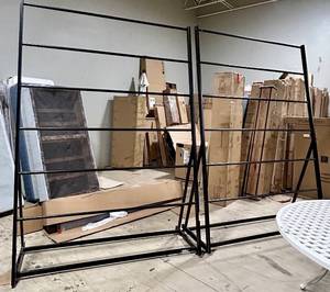 lot 955 image: Coaster Fine Furniture Black Metal Frame Rug Racks