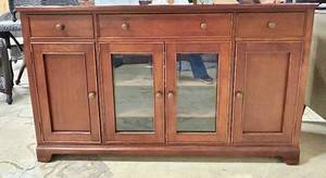 lot 1015 image: Winners Only 60-Inch Wide Wood Buffet Sideboard with Glass-Front Center Cabinets