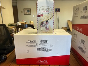 lot 96 image: Lindt Case 12ct Holiday Peppermint Gourmet Chocolate (MSRP - $138)