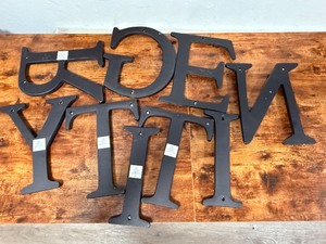 lot 20 image: 9 large, 12-inch wall-hanging letters. Crafted with a classic serif font and finished in a matte&nbspindustrial black