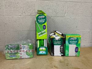 lot 309 image: LOT OF 4 Swiffer Merchandise