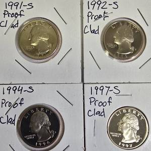 lot 49 image: Proof clad Washington Quarters from the years 1991, 1992 1994, and 1997.