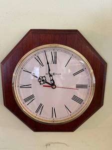 lot 11 image: Howard Miller Octagonal Wall Clock - White Dial, Roman Numerals, Dark Wood Case