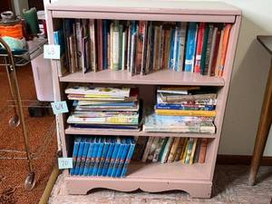 lot 71 image: Pink Wood Bookcase - 36 in H x 28 in W x 11 in D - books not inc