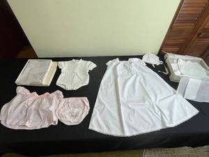 lot 101 image: Christening Outfits - White Lace Gown, Pink Dress, Knit Romper, Bonnet