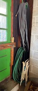 lot 202 image: Garden Hoses Gray & Green - 2 White Folding Chairs