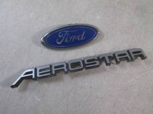 lot 26 image: (EC1) Ford and Aerostar Emblems...