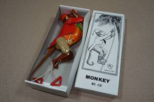 lot 191 image: Vintage Look Tin Litho Climbing Monkey