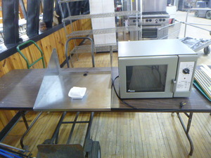lot 51 image: Amana Commercial Microwave Oven with Wall Rack