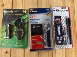 lot 91 image: Survival 2000 Series Swiss Army Knife and Compass, 7 in 1 Adjustable Wrench, Mini Maglite Pro - All New in Box