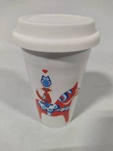 lot 30 image: Swedish Themed Porcelain Travel Mug