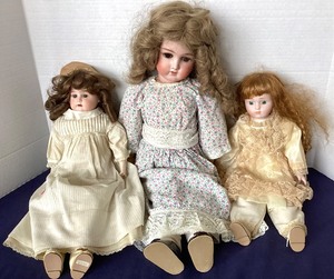 lot 8 image: Trio of Antique Dolls  Antique Doll Rope Bed