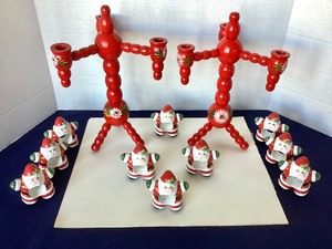 lot 187 image: Painted Swedish Wooden Folk Art Candelabra  Ceramic Santa Napkin Rings