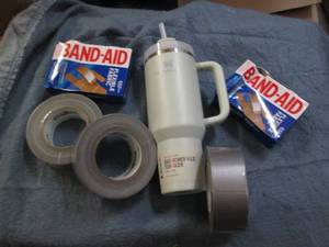 lot 80 image: Stanley mug, duct tape and bandaids...