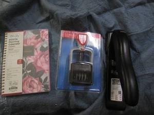 lot 90 image: Stapler, planner and stamp...