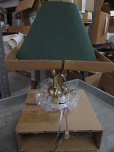 lot 24 image: Gold lamp with green cloth shade...