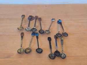 lot 57 image: Lot of (13) 120-grams (total) 925 Sterling Silver Souvenir Spoons