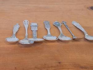 lot 84 image: Lot of (7) 187-grams (total) 60G Silverplated Souvenir Spoons