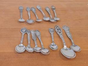 lot 86 image: Lot of (13) 150-grams (total) 60G Silverplated Souvenir Spoons