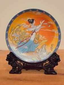 lot 116 image: Collectible Plate (1990s) (Imperial Jingdezhen) - Legends of West Lake Collection Limited Edition Rising Sun Terrace with Ornate Plate Stand