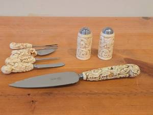 lot 191 image: French Ivory Handled Stainless Steel Flatware - Salt and Pepper Shakers, Cake Server, Butter Knife, Knives (x2), Olive Forks (x2) by Sheffield (England)