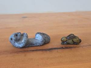 lot 322 image: Lot of (2) Vintage Figurines - Wolf Original Floating Otter Figurine Black Soapstone (Canada) 4 long, Japanese Netsuka Miniature Rabbit Figurine 2 long