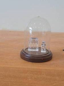 lot 331 image: Lot of (2) Retired Swarovksi Crystal City Collection Enclosed in Plastic Dome with Wood Base