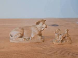lot 338 image: Lot of (2) Hand Carved Nativity Animals - Cow 4 long and Sheep 2 long