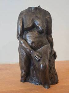 lot 340 image: Bronze Sculpture of Nude Woman Seated on a Wood Stump