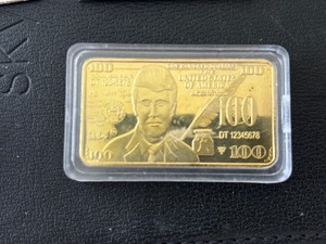 lot 37 image: Gold Plated Trump $100 Dollar Bar