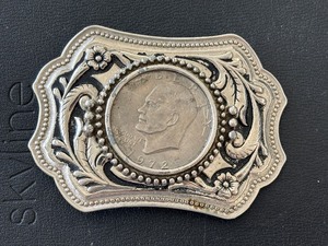 lot 52 image: Eisenhower Dollar in Belt Buckle