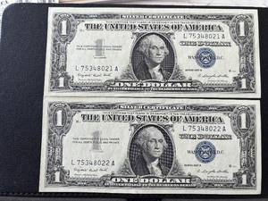 lot 56 image: 1957 A Blue Seal $1 Dollar Silver Certificates Consecutive