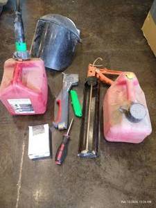 lot 76 image: Misc. Tools - Hammer Stapler, Gas Cans, Face Shield