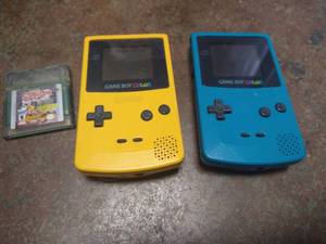 lot 142 image: (2) Nintendo Gameboy Colors - Missing Back Battery Covers
