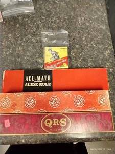 lot 210 image: Vintage Player Piano Rolls, Slide Rule, & Abbott & Costello 8MM