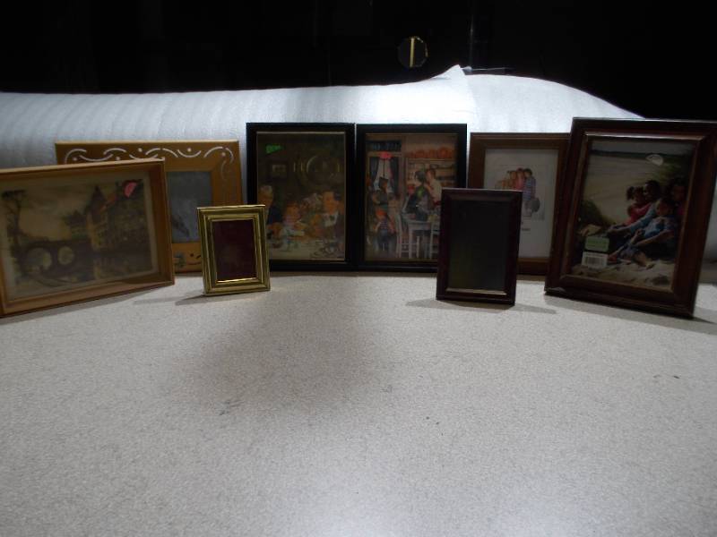 lot 11 image: An assortment of prints and pictures.