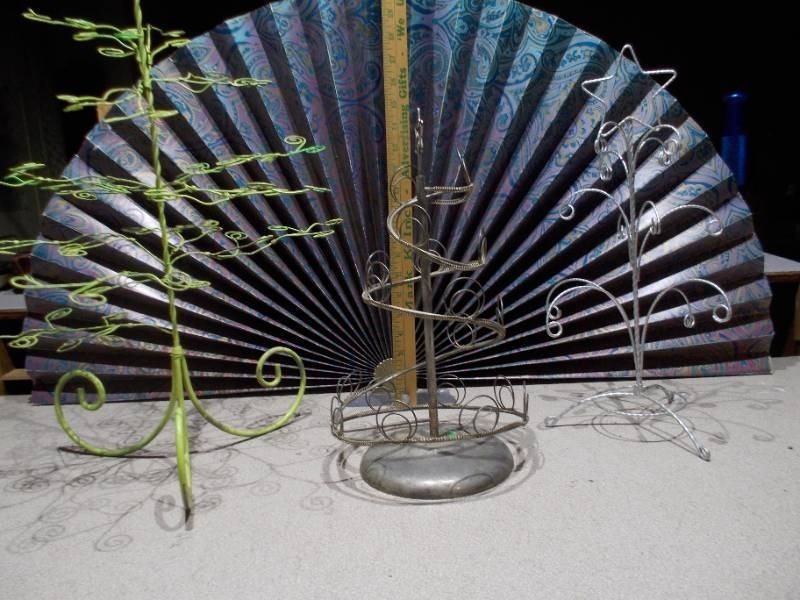 lot 24 image: These are various metal wire ornament or jewelry display stands,