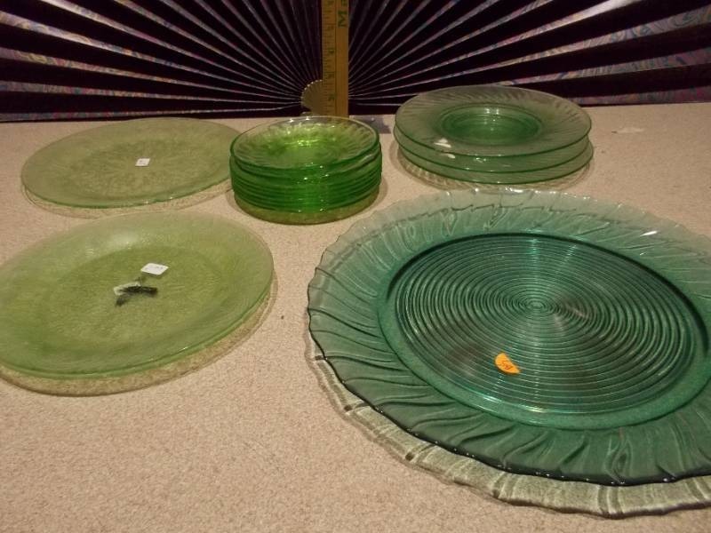 lot 27 image: The image displays various sets of vintage green glass plates and bowls,