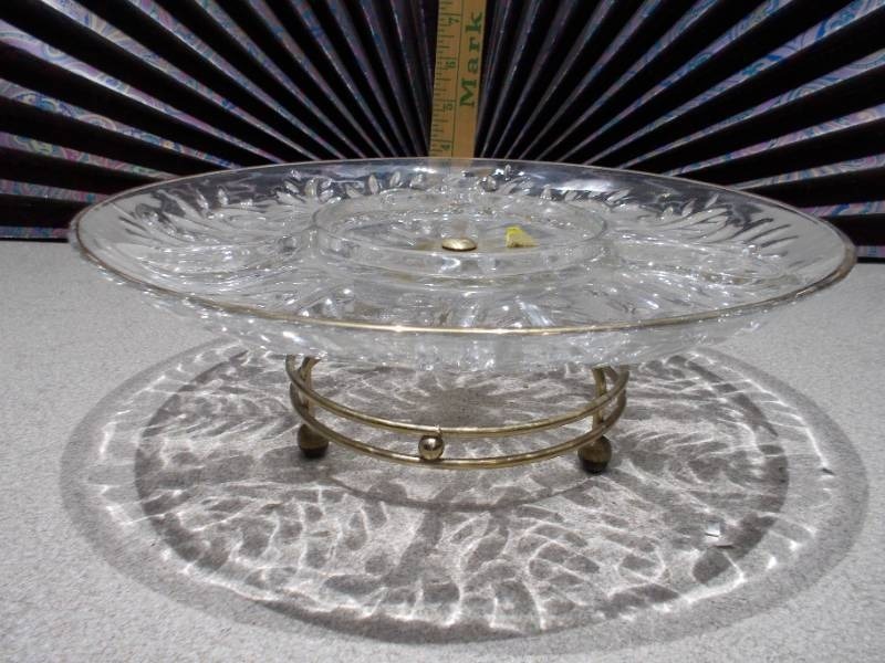 lot 38 image: This is a vintage Federal Glass Leaf and Dot pattern clear glass lazy susan relish tray with an attached gold-tone footed stand.