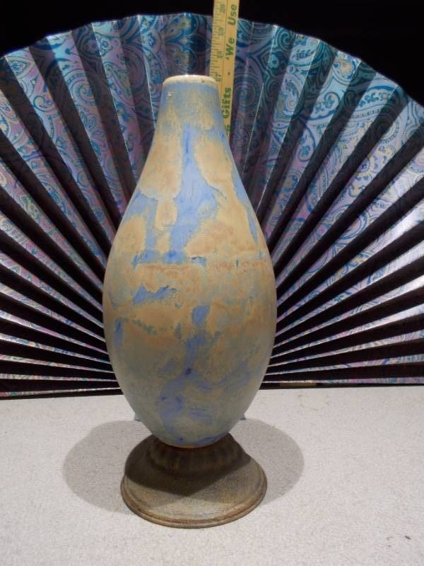 lot 45 image: This is a handmade porcelain vase with a blue and rust crystalline glaze